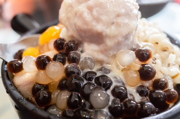 eating shaved ice with colorful dessert