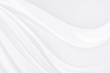 White fabric texture that is white silk background with beautiful soft blur pattern.