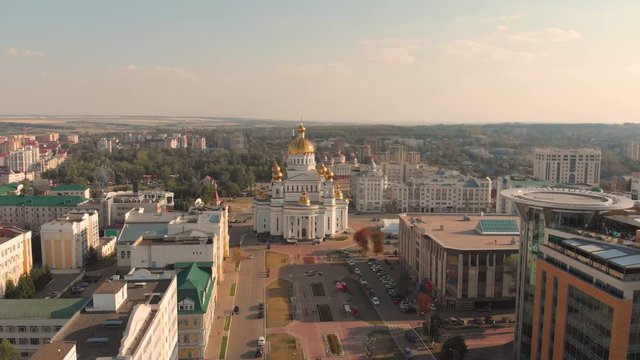 Aerial flying lowering down to the russian orthodox the Cathedral of St. Theodore Ushakov in Saransk, Russia. Taken by drone at sunset