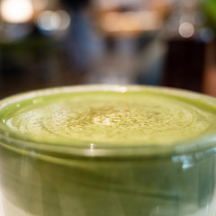 cup of matcha milk tea on table