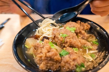 Taiwanese food of soup noodles with pork ribs cakes