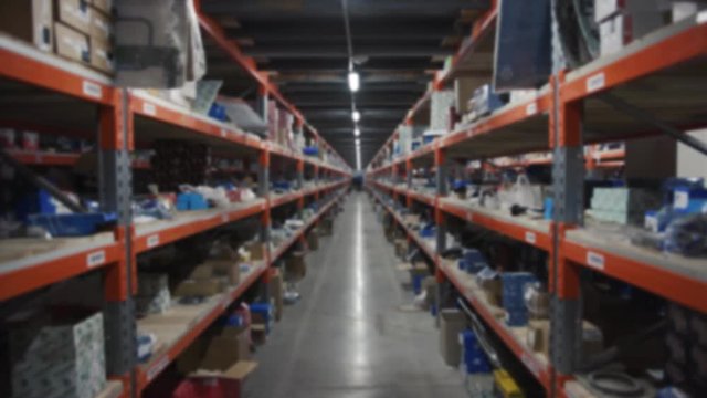New York, USA - March, 5, 2019: Shot of shelf at the factory industrial industry logistic package transportation warehouse shelving storehouse vehicle crate delivering driver machine slow motion