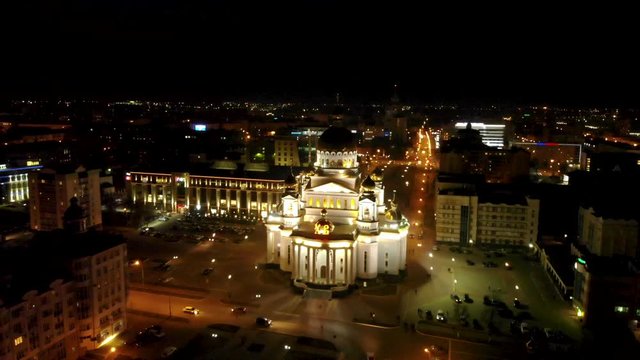 Aerial flying rise over russian orthodox the Cathedral of St. Theodore Ushakov in Saransk, Russia. Taken by drone at night