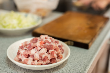 cut raw pork on wooden table