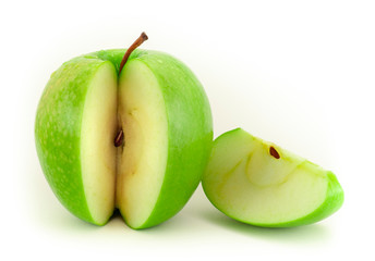 Section of green apple with one slice, isolated on white