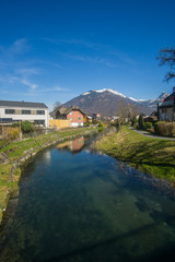 Beautiful river and mountains view from a little village with the name Niederurnen in Switzerland. 