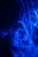 Fototapeta premium Blue smoke on black background.