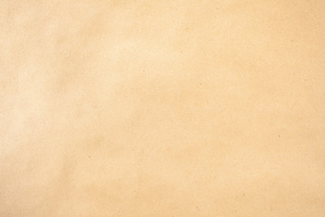 Brown paper background with tiny flecks of fibers texture horizontal shot from above