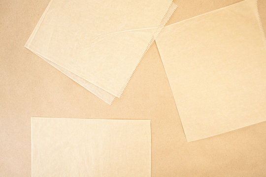 Layers Of Parchment And And Craft Paper Background Texture With Serrated Edges In Beige And Tan Colours