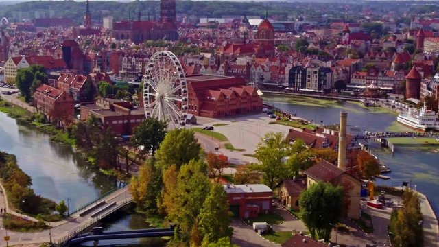Aerial shot of feris wheel and old town in Gdańsk city in Poland.