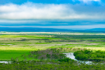 Fototapeta na wymiar Kushiro Shitsugen national park in Hokkaido in summer day, view from Hosooka observation deck, the largest wetland in Japan. The park is known for its wetlands ecosystems