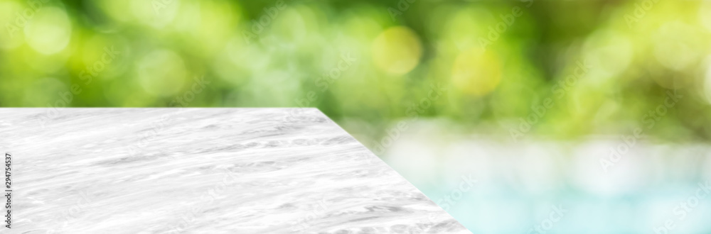 Poster marble table top product display background with blur nature garden and swimming pool.perspective st