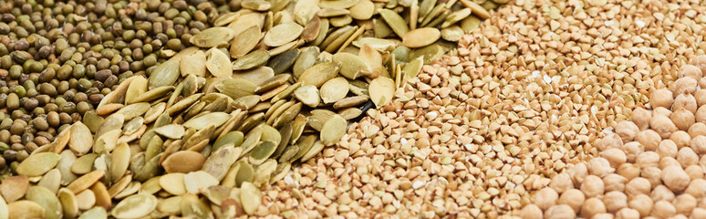 panoramic shot of moong beans, pumpkin seeds, raw buckwheat and chickpea