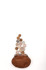 top view of plaid wallet near silver and golden coins isolated on white