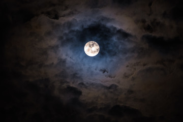 Obraz na płótnie Canvas Mysterious dark night sky with full moon and clouds