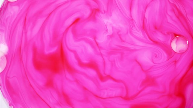 Mixing paint, butter and milk. Gorgeous colorful and vibrant background, cosmetic effect. Multicolored acrylic paint, abstract colorful paint and slow motion.
