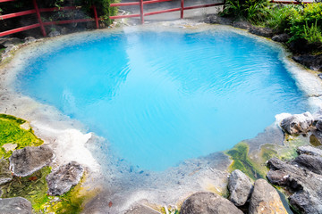 Kamado cooking pot Hell Beppu Onsen in cobalt blue Gokuraku paradise district, so beautiful hot spring in light blue color at Oita, Japan.