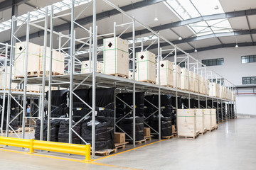 Large hangar warehouse of industrial and logistics companies. Long shelves with a variety of boxes. industry space and hardware box for delivery, business logistic distribution storage cargo concept.