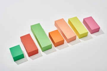 multicolor blocks of increase chart with shadow on white background