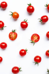 Fresh tomatoes, whole and half cut isolated on white background.