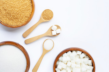 Various types of sugar on white background.