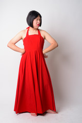 Fototapeta premium Full body shot of angry young gay Asian man looking upset