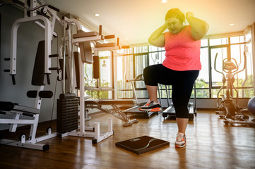 Fototapeta premium plump fat woman angry on overweioght of scale increase