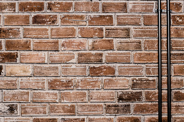 brick wall with cable steel pipe old grunge texture industrial background