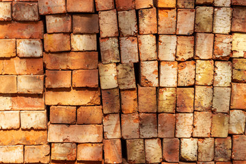 pile of orange baked clay bricks
