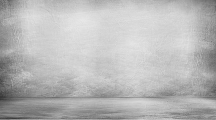 empty room with a concrete wall, gray background. Room for studio.
