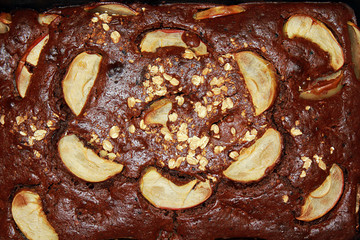 Chocolate cake with apples closeup
