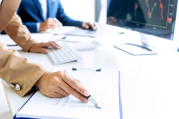 business man and woman sit at the table
