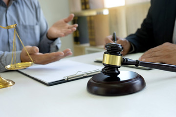 Judge or lawyer talking  with team or client