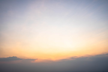 Sunset sky with orange clouds. The sky and sun at sunrise nature background.
