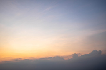 Sunset sky with orange clouds. The sky and sun at sunrise nature background.