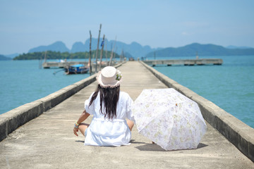 woman sit at habor, Krabi province, thailand