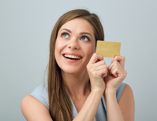 Smiling woman holding bank card.
