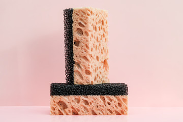Soft yellow sponge with black stripe for dishwashing and wet cleaning, background for text, advertising