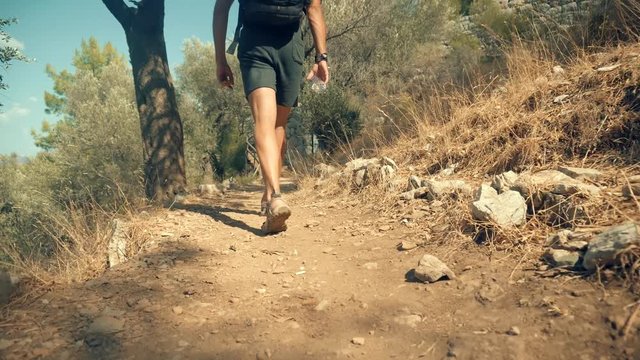 Man In Sandals Walking In Ancient City.Beautiful Tourist Walking Along Trail On Greek Ancient Town Amos.Man Legs Walking On Stairs.Male Climbs A Wooden Staircase.Guy Exploring Old Town In Turkey.