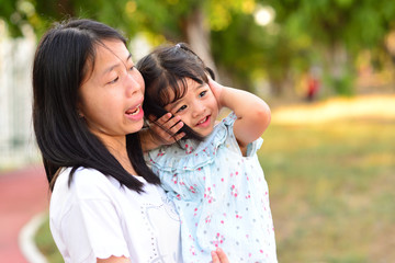 Little Child Girl with Mother at The Public Park