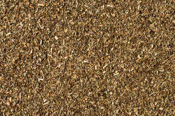 Dried basil texture. Background with copyspace. Close up. Top view