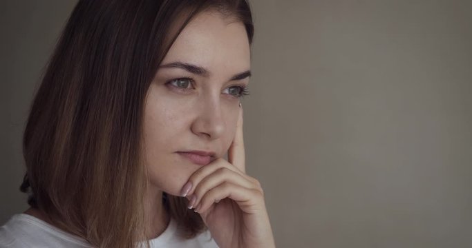 Portrait of young thoughtful woman with new idea.