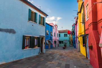 Fototapeta na wymiar The narrow streets among the colored houses
