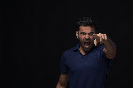 violent young man screaming	