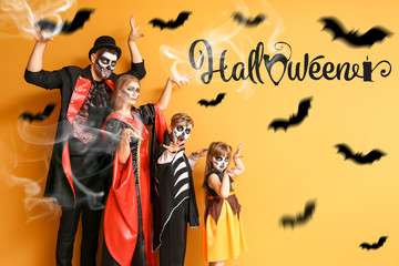 Family in Halloween costumes on color background