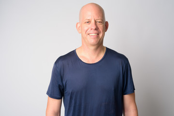 Obraz premium Portrait of happy mature handsome bald man smiling