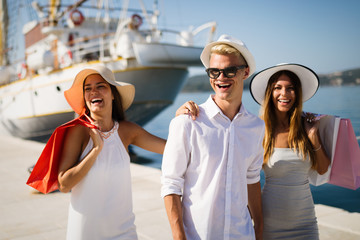 Happy tourist friends having fun on summer travel vacation