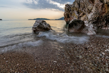 sea shore, long exposure, rocks in the water washed by the sea
