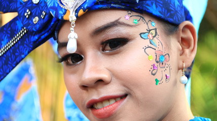 Pekalongan / Indonesia - October 6, 2019: beautiful women and handsome men participate by wearing unique costumes at the Pekalongan batik carnival 