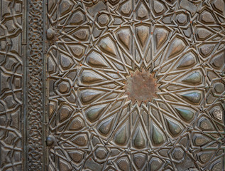 Ornaments of the bronze plate door of ancient historic mosque of Sultan Basque, Cairo, Egypt
